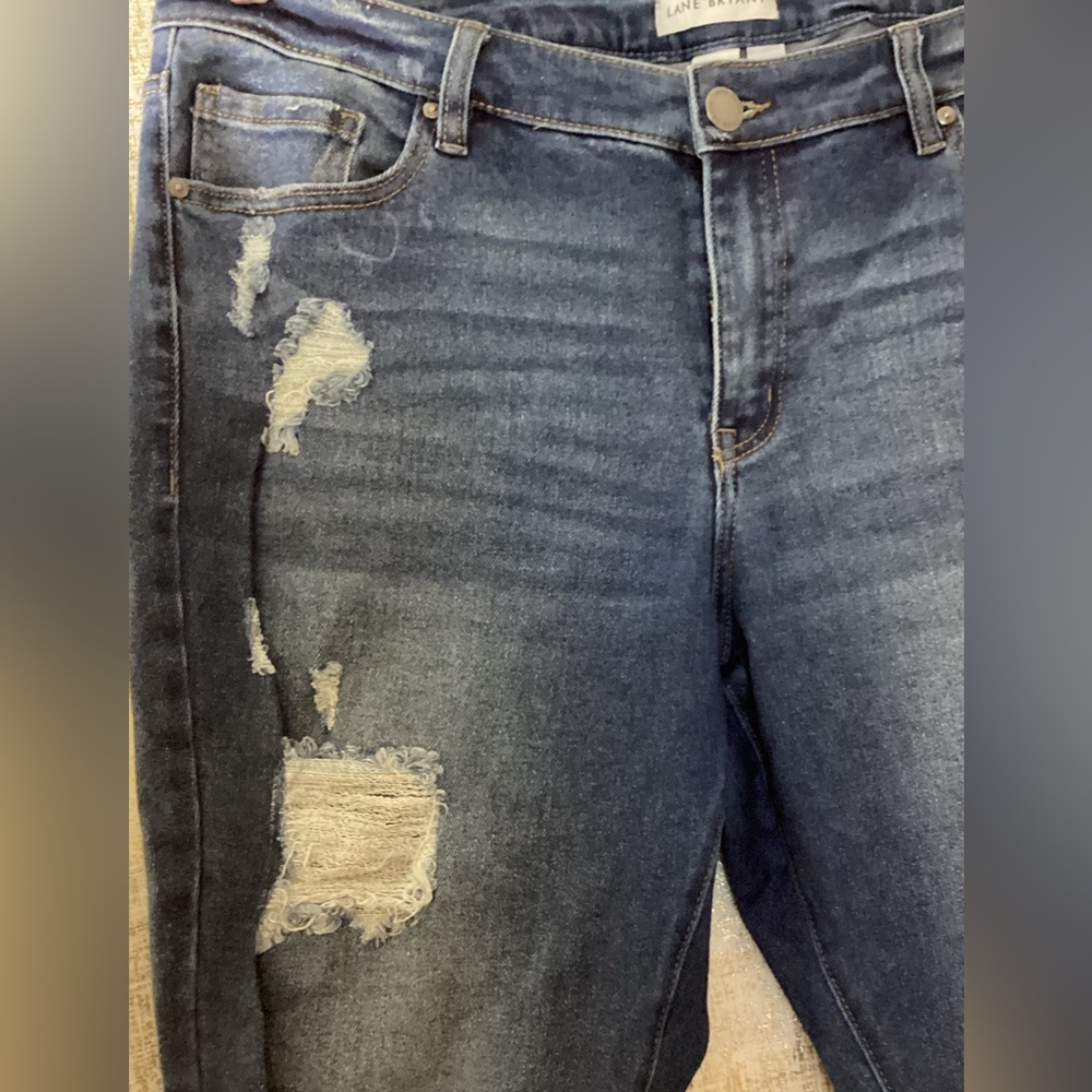 Lane Bryant Signature fit mid- rise skinny jeans with rips.